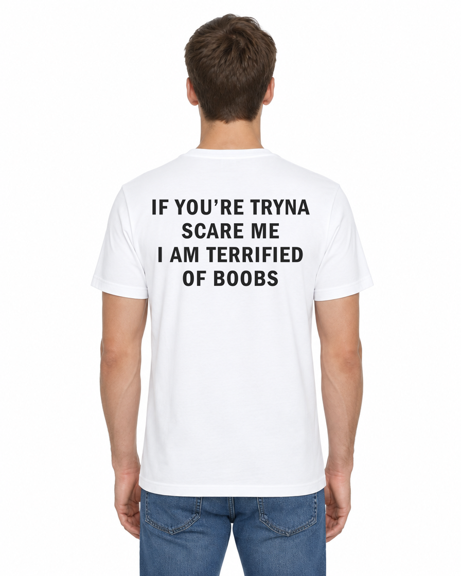 Back view of a man wearing the white If You’re Tryna Scare Me I Am Terrified of Boobs funny t-shirt