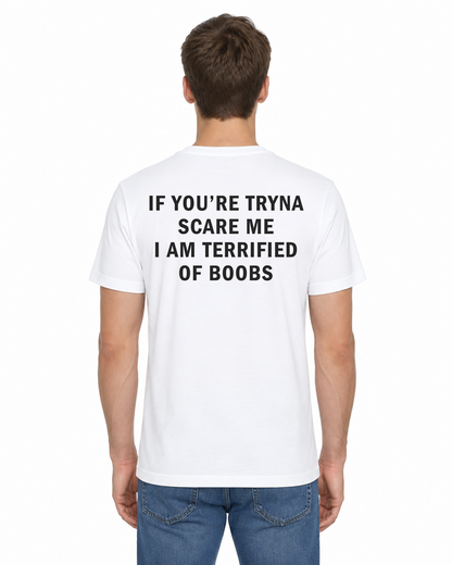 Back view of a man wearing the white If You’re Tryna Scare Me I Am Terrified of Boobs funny t-shirt